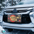 wrestling mom license plate on car in snowy setting — red gold headgear sports design
