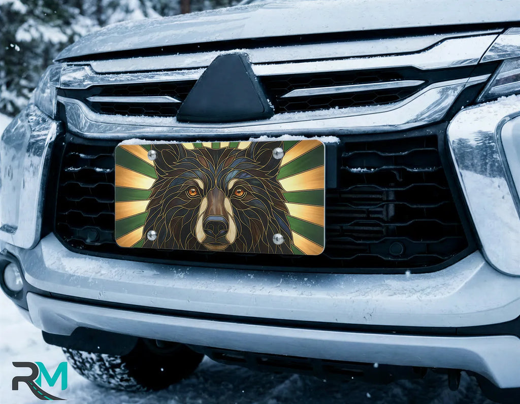 bear face license plate on car in snowy setting — stained glass woodland bear design
