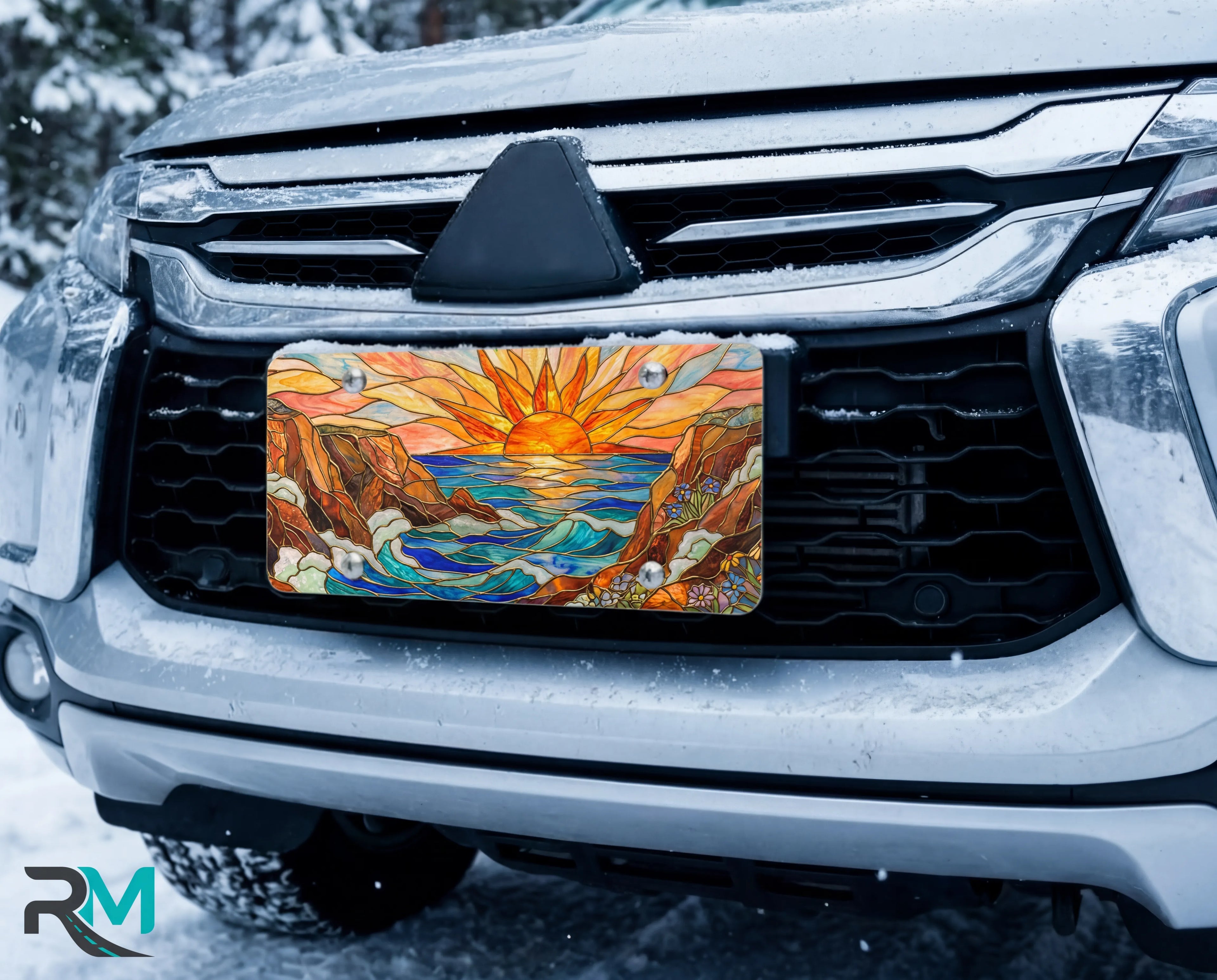 sunrise ocean cliffs vanity plate on car in snowy setting — warm sunrise orange gold ocean cliffs design