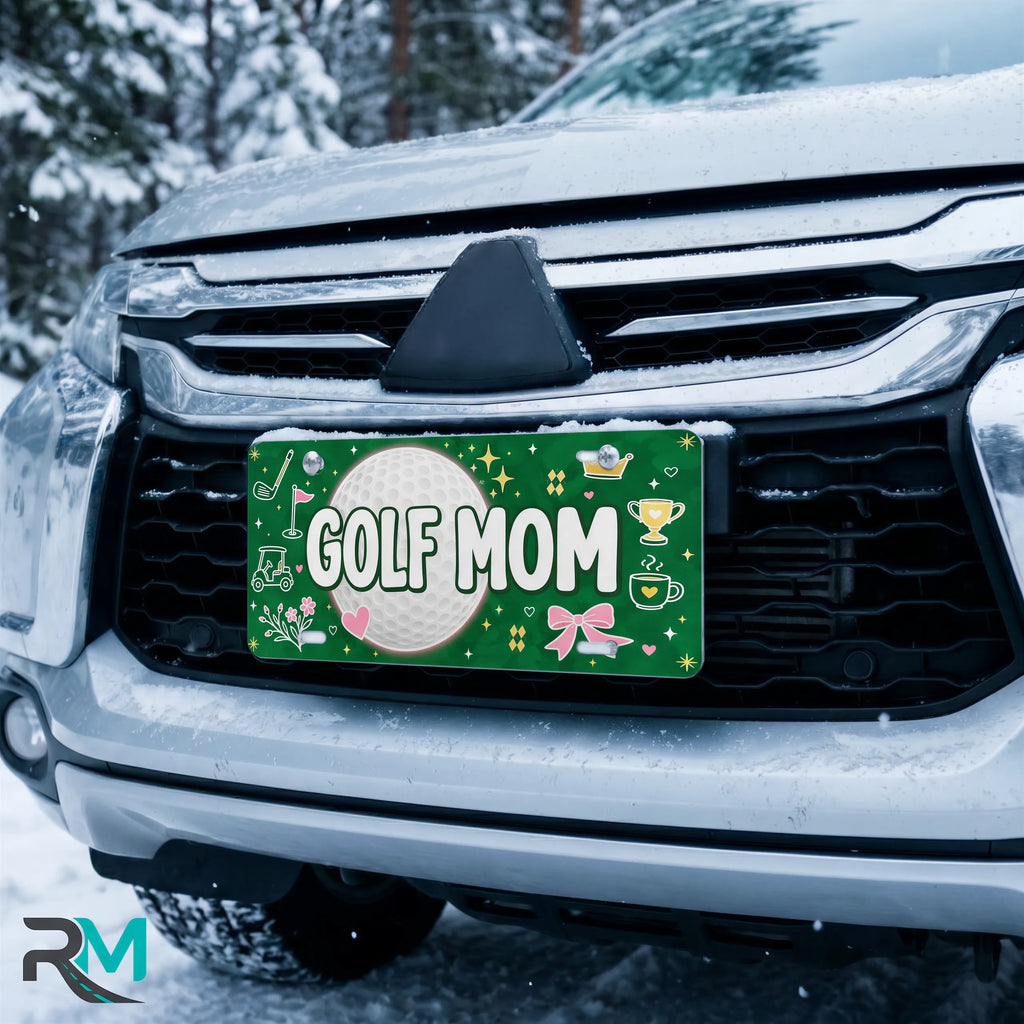 golf mom license plate on car in snowy setting — green golf ball GOLF MOM design