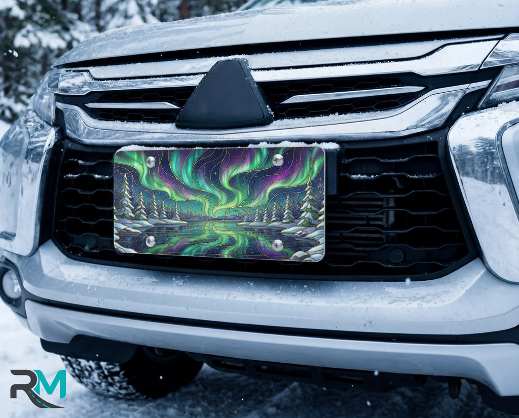 northern lights aurora vanity plate on car in snowy setting — vivid emerald violet aurora winter lake design