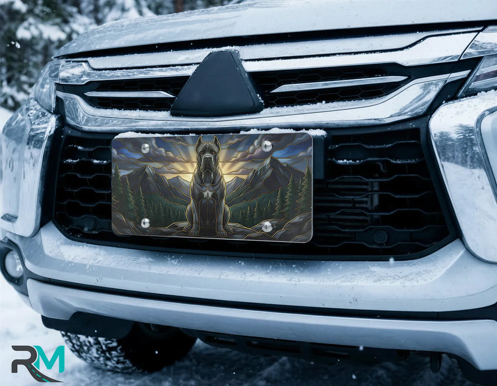 mountain mastiff vanity plate on car in snowy setting — warm amber sunrise guardian dog design
