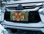 stained glass lion license plate on car in snowy setting — warm amber gold lion design