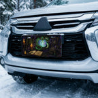green serpent crystal ball vanity plate on car in snowy setting — jewel green serpent orb design