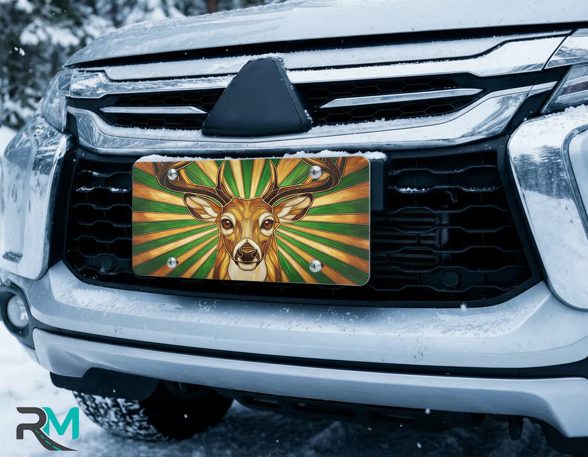 stag deer license plate on car in snowy setting — woodland amber green stag design