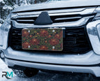 vintage floral chrysanthemum vanity plate on car in snowy setting — deep burgundy chrysanthemums lush green leaves design
