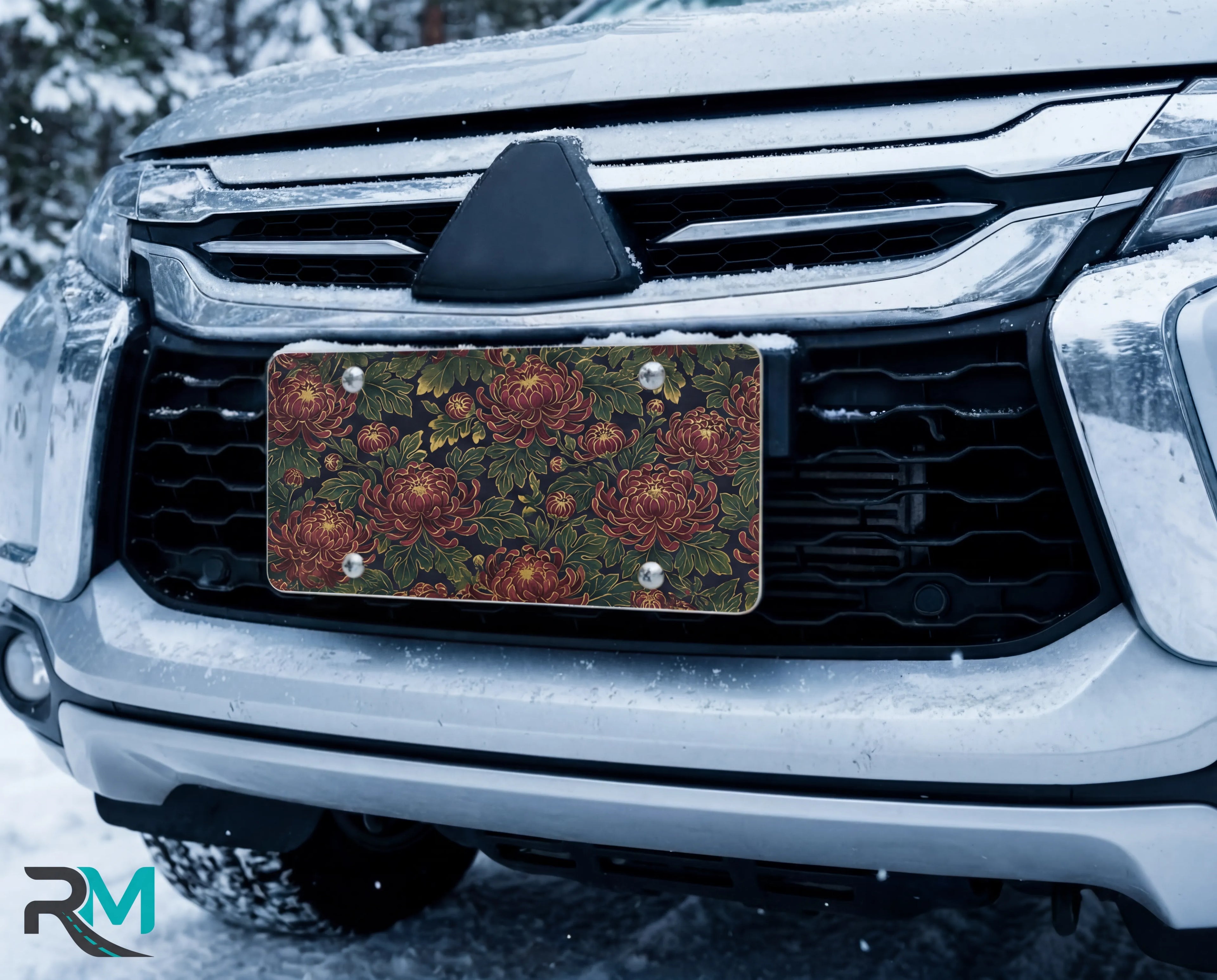 vintage floral chrysanthemum vanity plate on car in snowy setting — deep burgundy chrysanthemums lush green leaves design