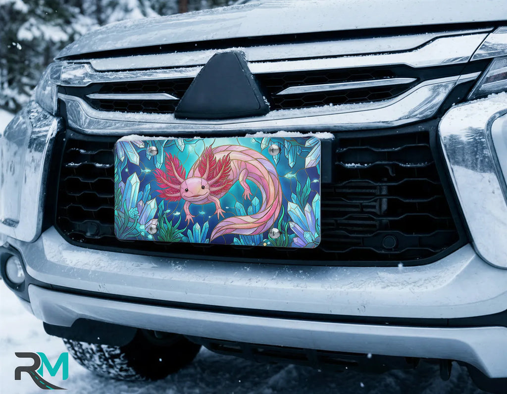 stained glass animal vanity plate on car in snowy setting — vivid jewel tone wildlife design