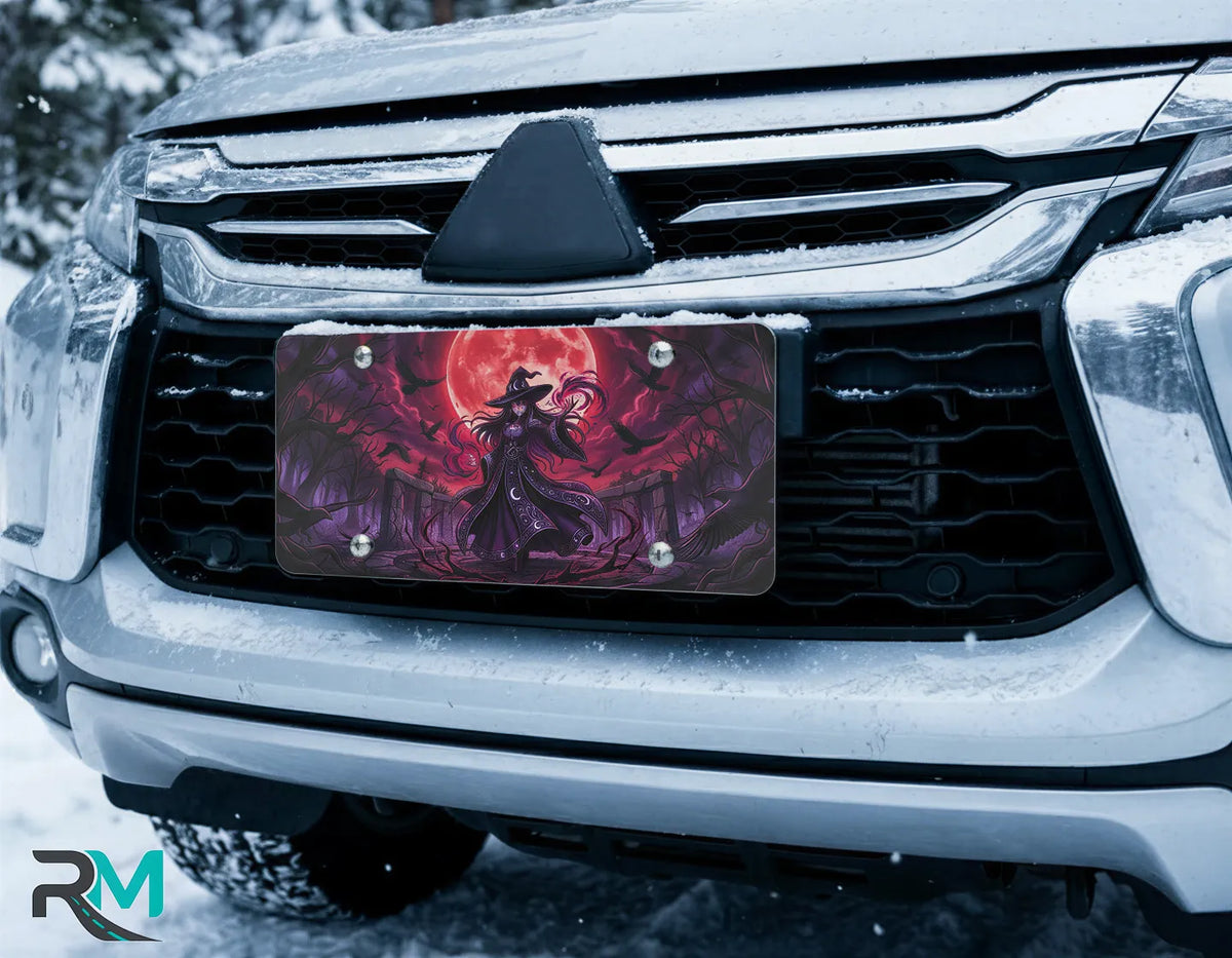 witch silhouette vanity plate on car in snowy setting — jewel purple witch blood-red moon bats design