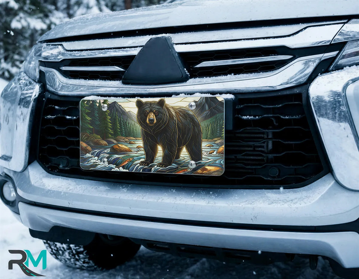 bear river license plate on car in snowy setting — mountain wilderness wildlife design