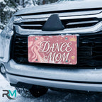 dance mom license plate on car in snowy setting — soft rose ballet slipper dance design