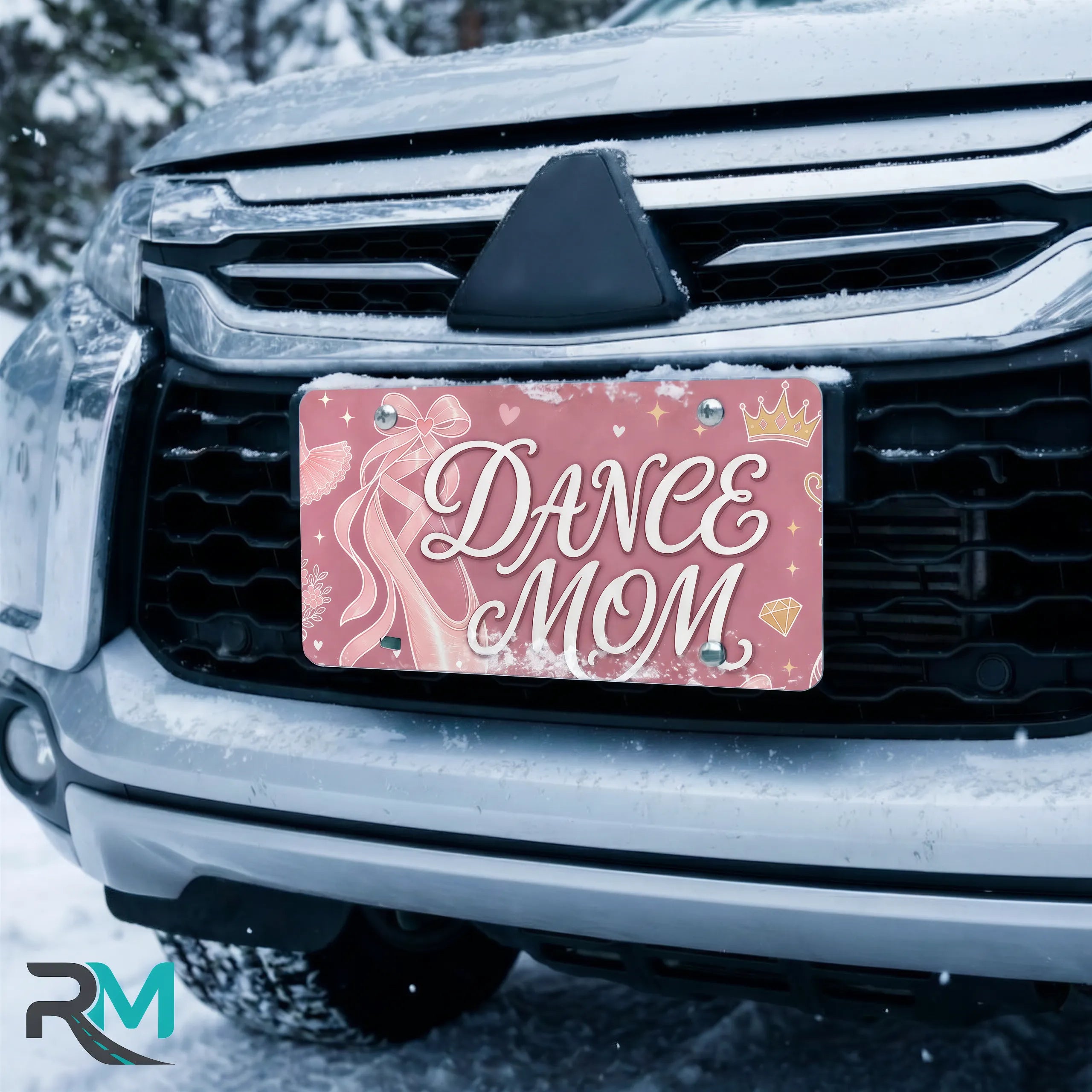 dance mom license plate on car in snowy setting — soft rose ballet slipper dance design