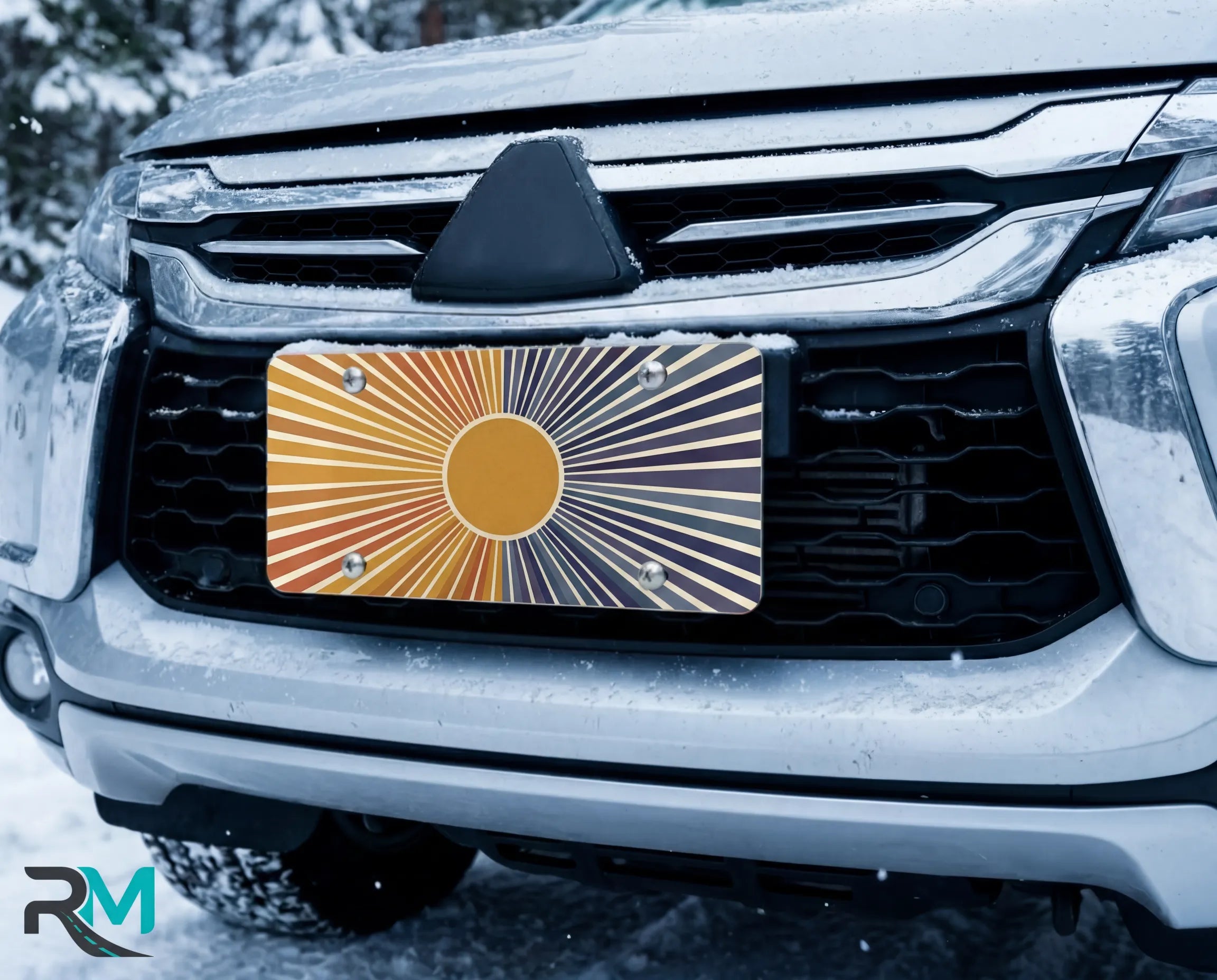 indigo sunrise license plate on car in snowy setting — retro amber to deep blue sunburst