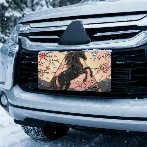 black unicorn vanity plate on car in snowy setting — midnight black unicorn cherry blossom design