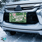 lacrosse mom license plate on car in snowy setting — green pink lacrosse sports design