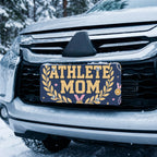 athlete mom license plate on car in snowy setting — navy gold laurel soccer sports design