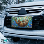 sea otter stained glass vanity plate on car in snowy setting — jewel teal otter kelp design