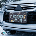 hockey mom license plate on car in snowy setting — navy hockey stick skate sports design