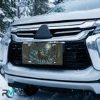 moonlit stag vanity plate on car in snowy setting — deep teal ink blue stag forest night design