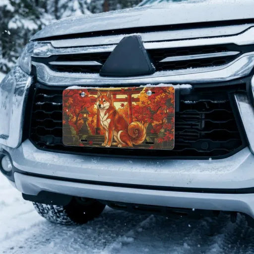 autumn fox torii vanity plate on car in snowy setting — vermillion torii fox amber maple design