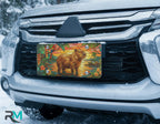 capybara sunset vanity plate on car in snowy setting — golden capybara tropical parrot design