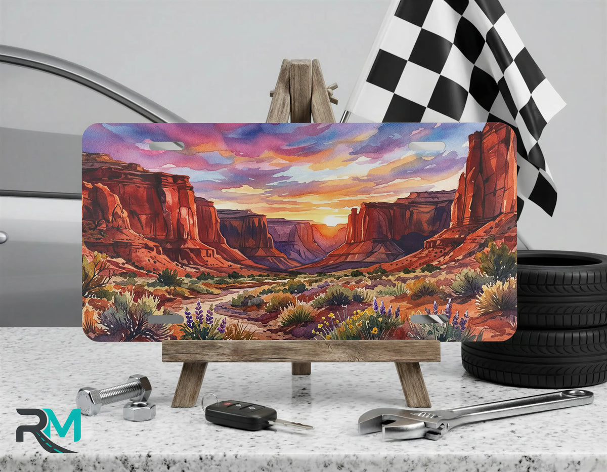 desert vanity plate displayed on stand — decorative aluminum license plate art