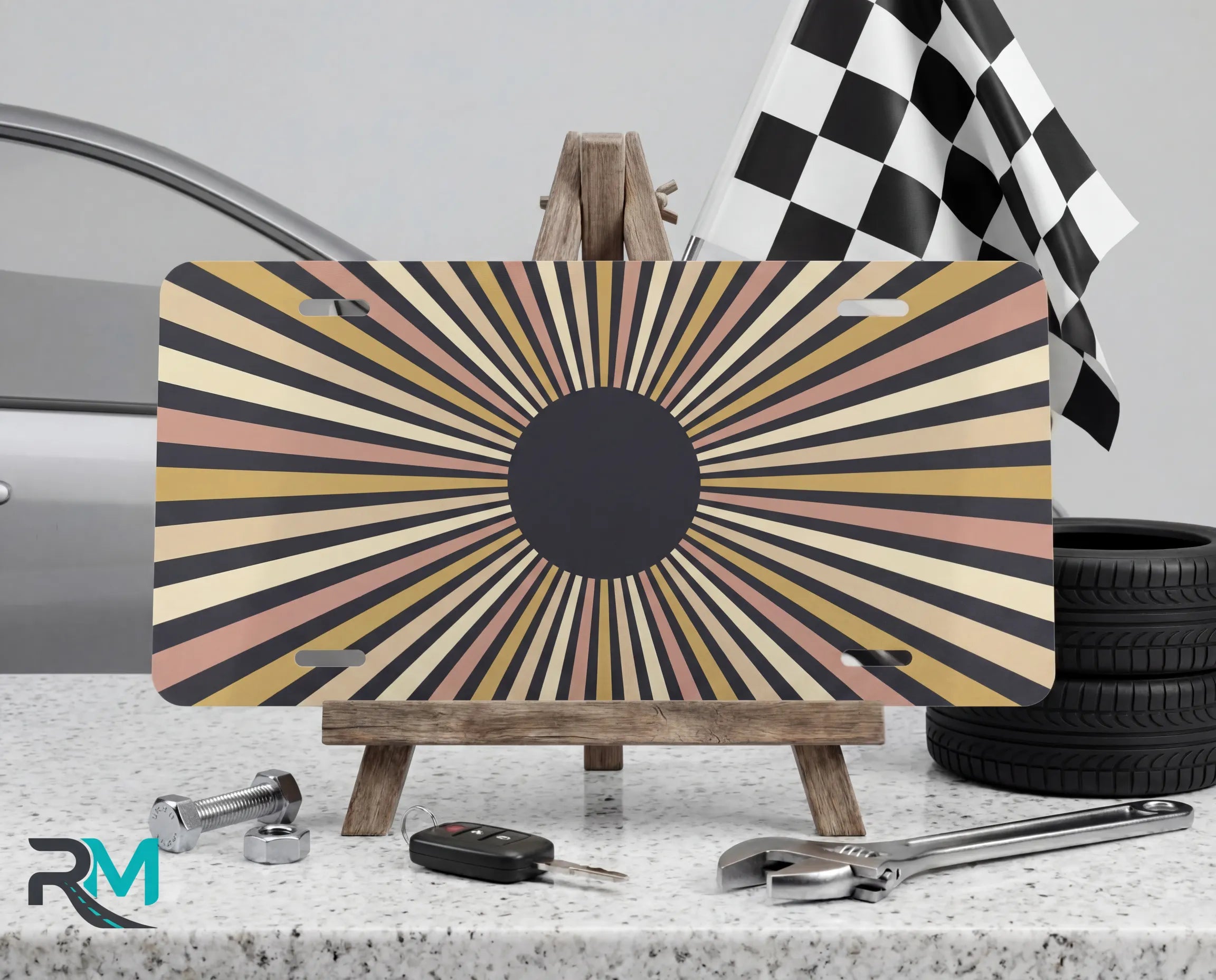 retro striped sunburst vanity plate on display stand — bold earth tone aluminum plate