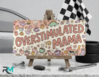 overstimulated mama collage vanity plate on display stand — pastel coffee blocks aluminum plate