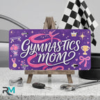 gymnastics mom vanity plate on display stand — purple pink ribbon trophy aluminum plate