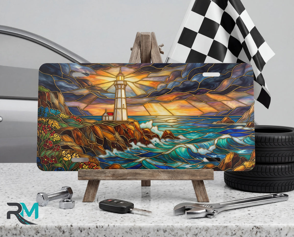 lighthouse seascape vanity plate on display stand — vivid coastal blue lighthouse crashing waves aluminum plate
