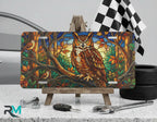stained glass owl vanity plate on display stand — warm amber forest green twilight aluminum plate