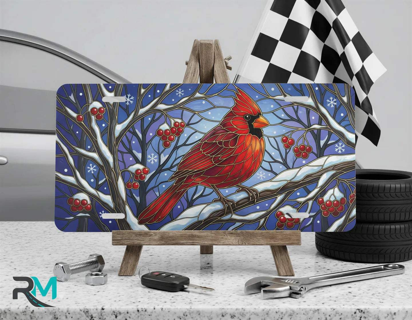 cardinal vanity plate on display stand — vivid scarlet red winter bird aluminum plate