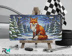red fox winter vanity plate on display stand — warm amber snowy forest aluminum plate