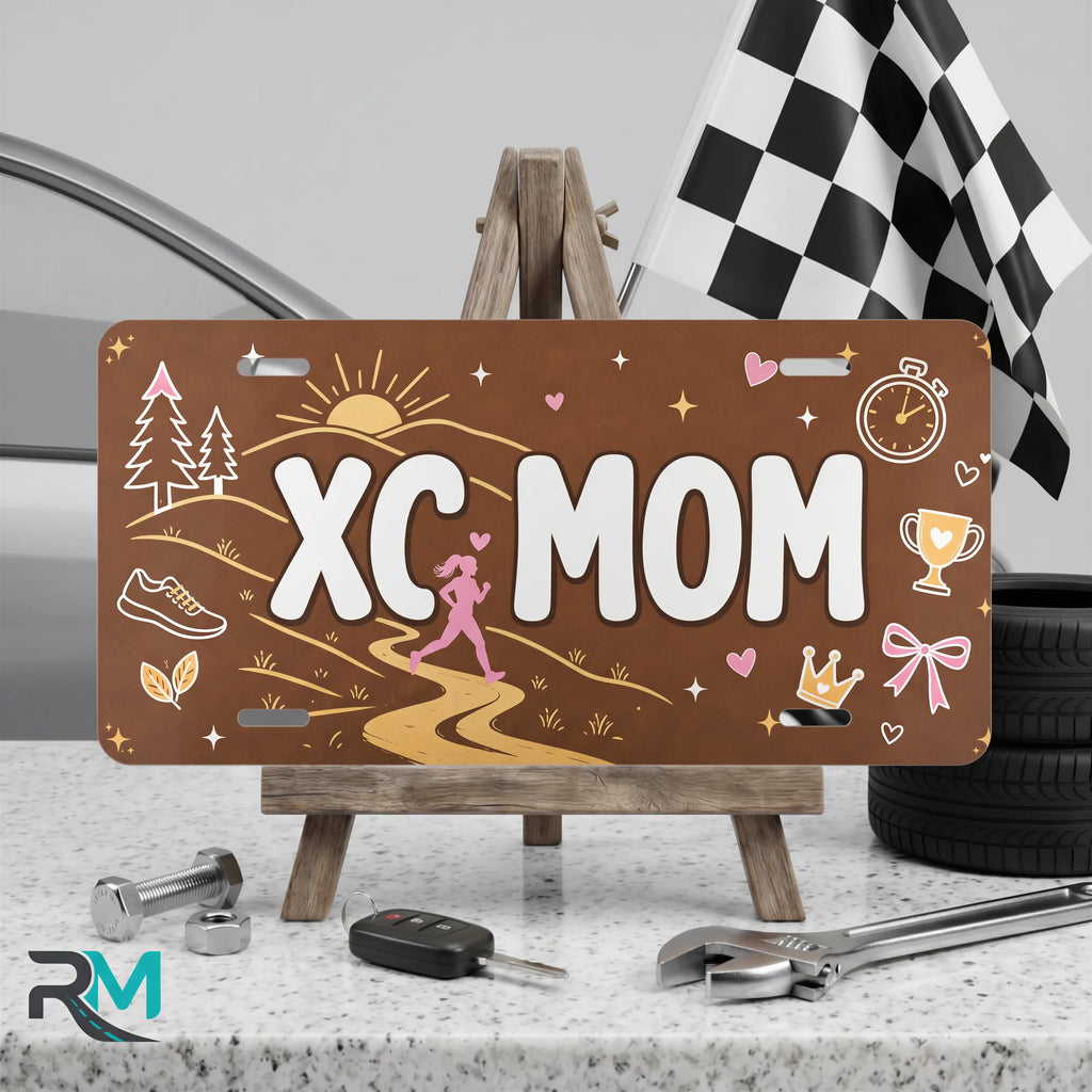 xc mom vanity plate on display stand — earthy sunrise trail aluminum plate