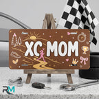 xc mom vanity plate on display stand — earthy sunrise trail aluminum plate
