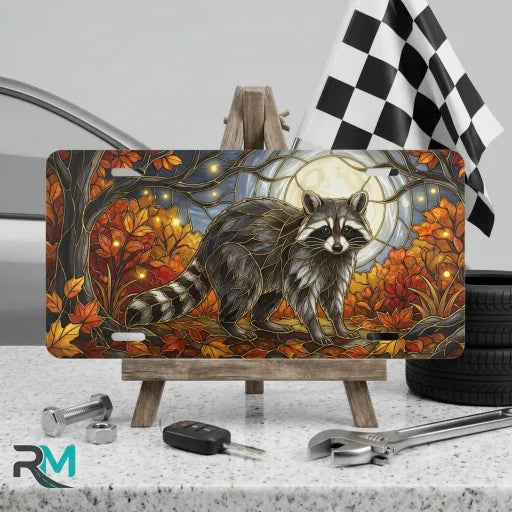 moonlit raccoon vanity plate on display stand — warm amber rust raccoon aluminum plate