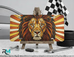 lion face vanity plate on display stand — warm amber rust golden lion aluminum plate