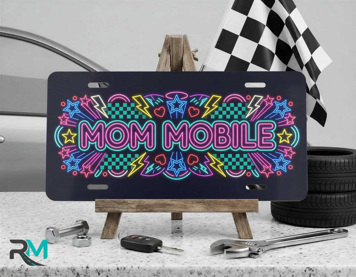 mom mobile vanity plate on display stand — neon pink blue yellow aluminum plate