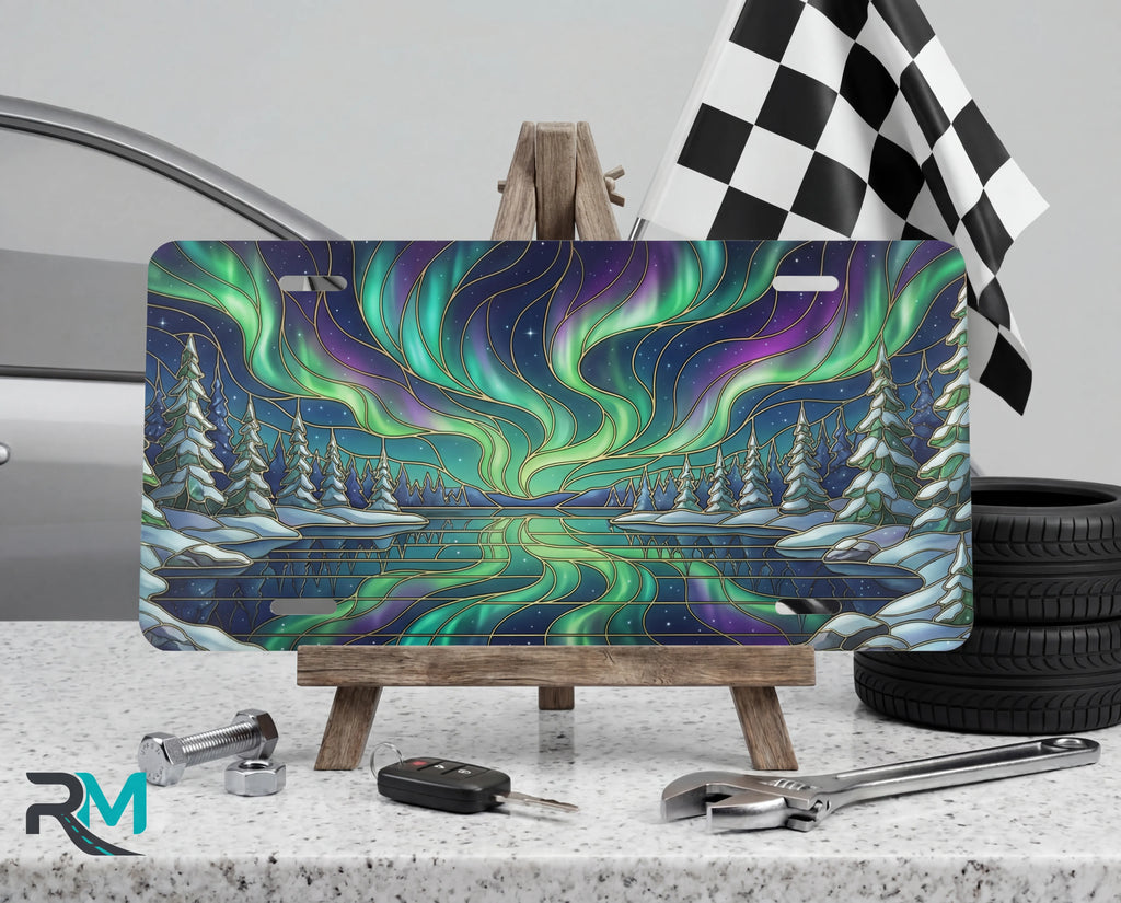 northern lights aurora borealis vanity plate on tire — vivid emerald violet aurora scenic front license plate