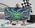 northern lights aurora borealis vanity plate on tire — vivid emerald violet aurora scenic front license plate