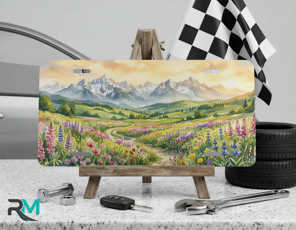 mountain wildflower vanity plate on display stand — watercolor alpine meadow license plate