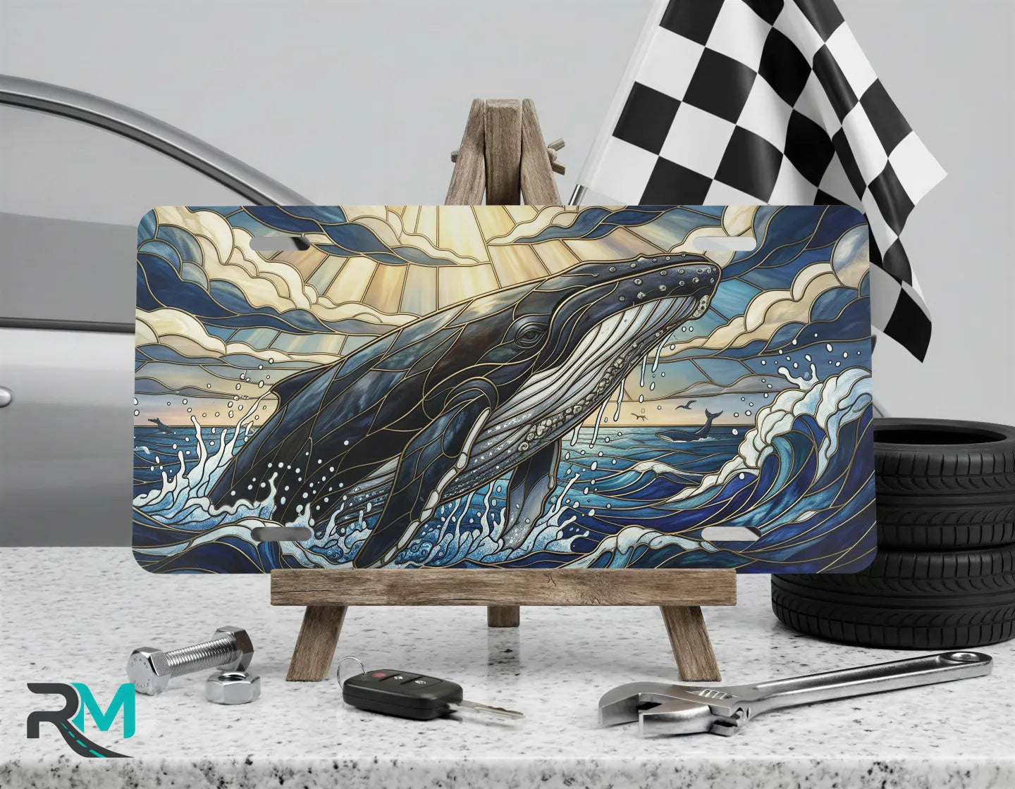 whale vanity plate on display stand — deep ocean blue gold breaching whale aluminum plate