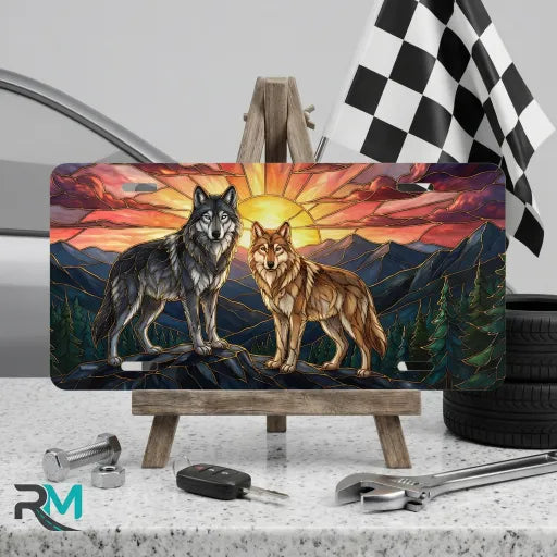 sunset wolves vanity plate on display stand — jewel tone wolves sunrise mountain aluminum plate