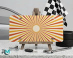 retro orange sunburst vanity plate on display stand — warm peach cream aluminum plate