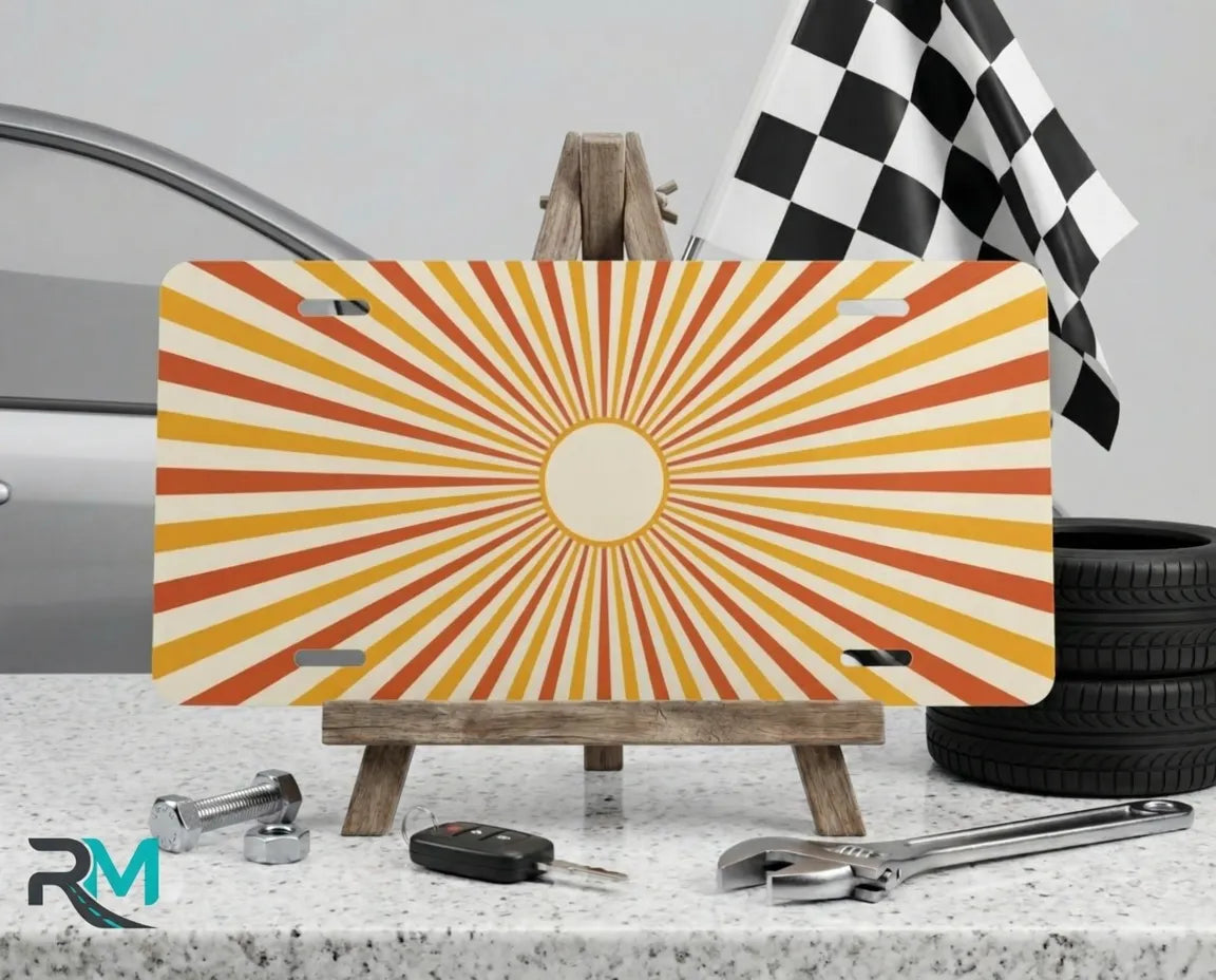 retro orange sunburst vanity plate on display stand — warm peach cream aluminum plate