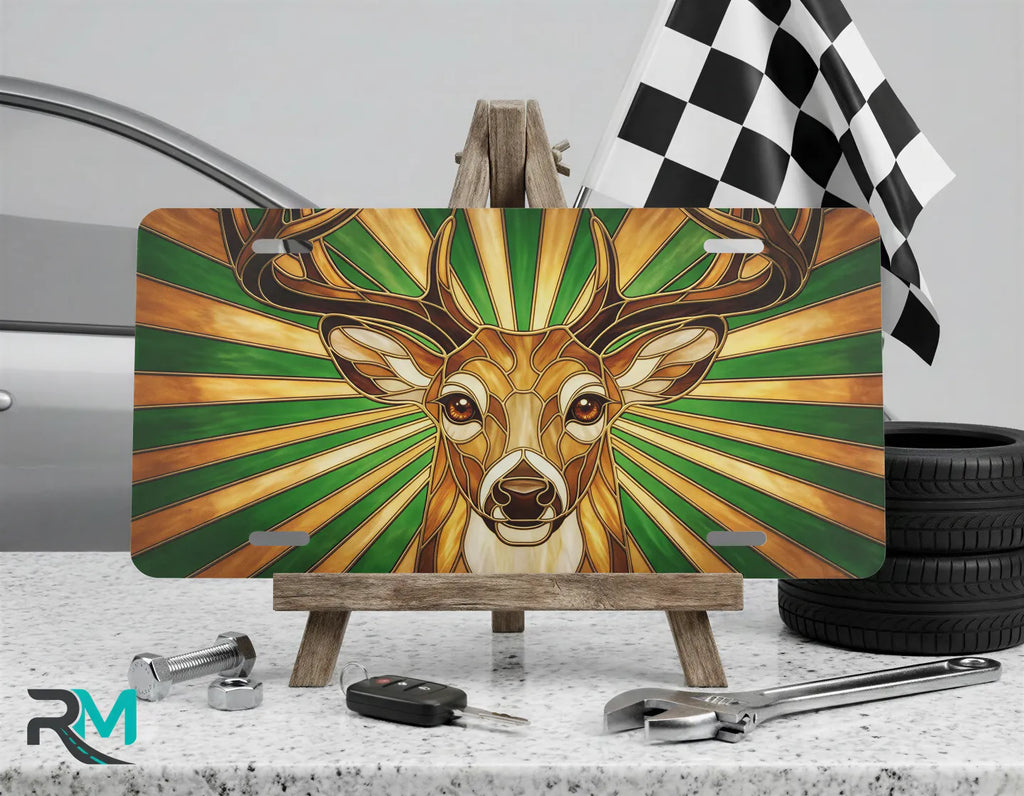 stag portrait vanity plate on display stand — rich amber forest green deer aluminum plate