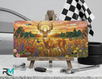 sunset deer vanity plate on display stand — warm amber wildflower buck aluminum plate