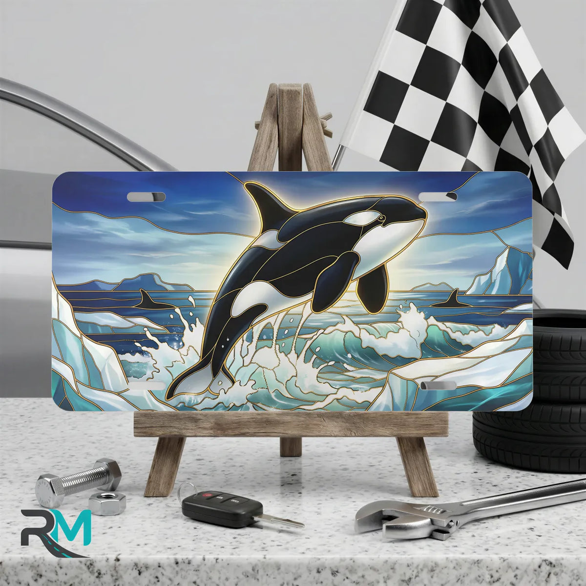 orca whale vanity plate on display stand — vivid orca black white icy blue aluminum plate
