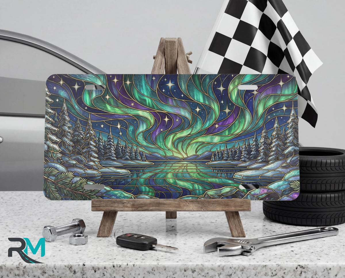 northern lights lake scene vanity plate on tire — jewel teal purple aurora winter scenic front license plate