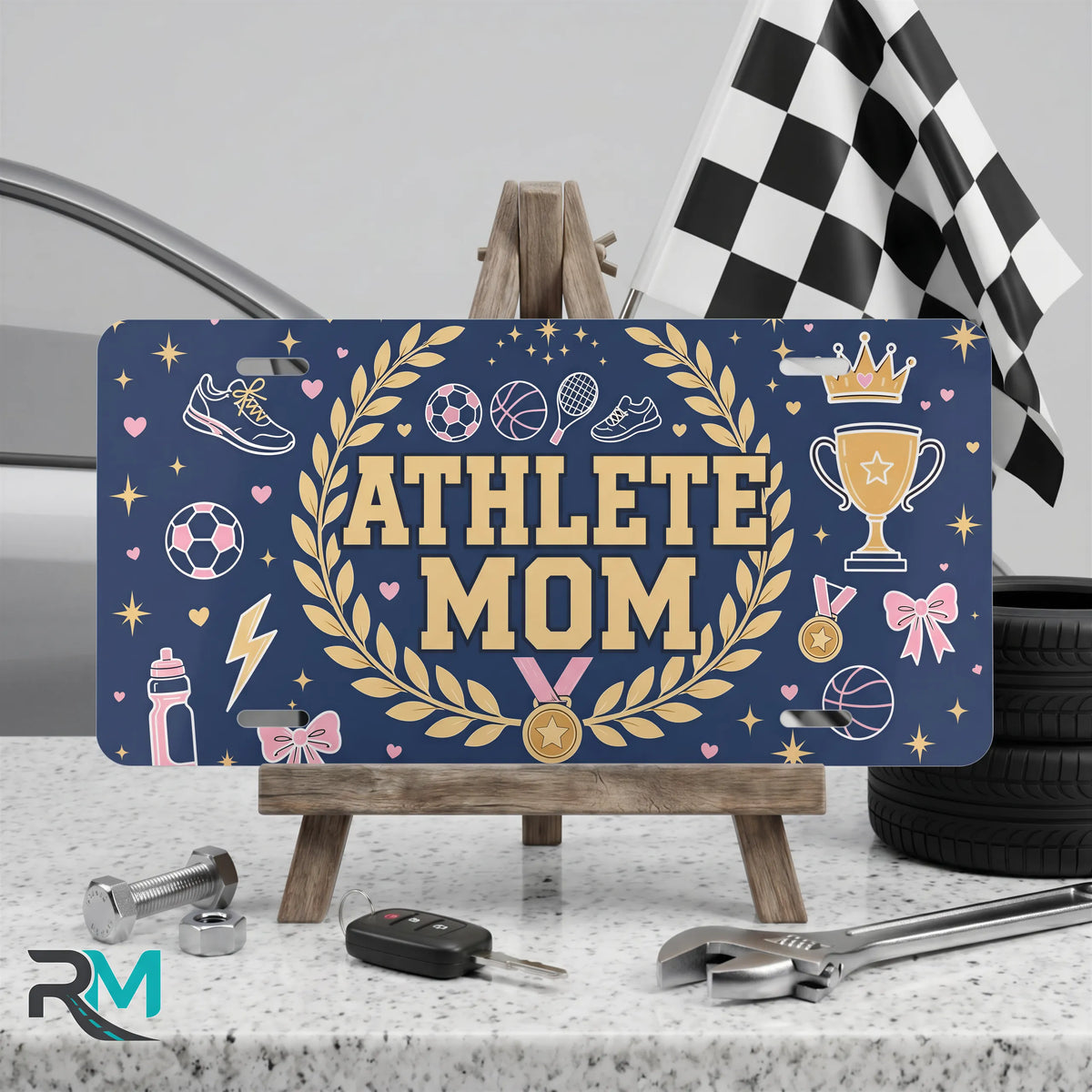 athlete mom vanity plate on display stand — deep navy gold laurel soccer aluminum plate